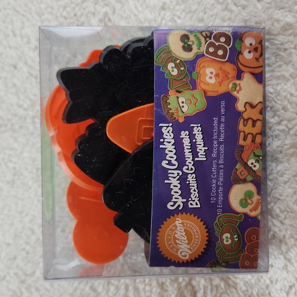 WILTON Halloween cookie cutters cute set of 9, one pumpkin missing.  Adorable!